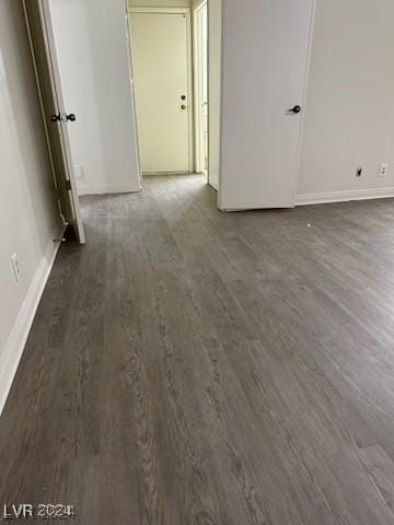 unfurnished room featuring dark hardwood / wood-style flooring