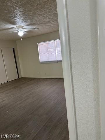 unfurnished room featuring dark hardwood / wood-style flooring