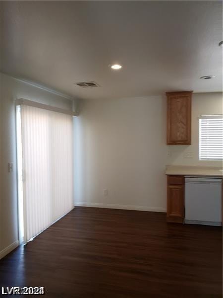 interior space with white dishwasher and dark hardwood / wood-style floors