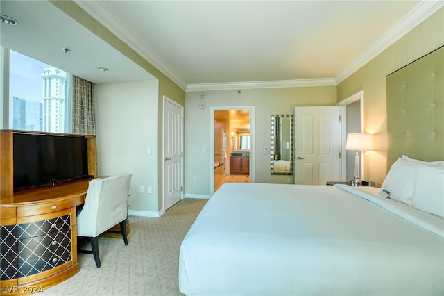 bedroom with crown molding and ensuite bathroom