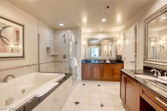 bathroom with vanity, shower with separate bathtub, and tile patterned flooring