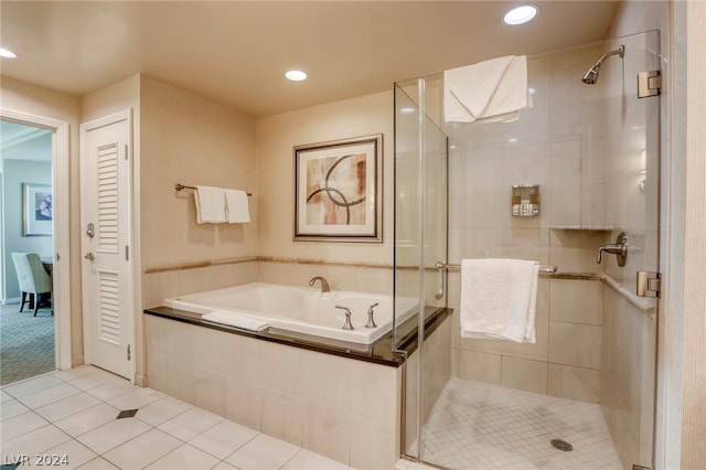 bathroom featuring plus walk in shower and tile patterned flooring