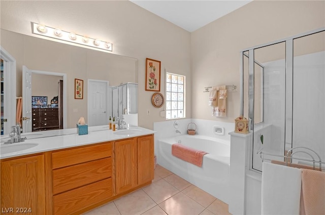 bathroom featuring tile patterned floors, separate shower and tub, and vanity