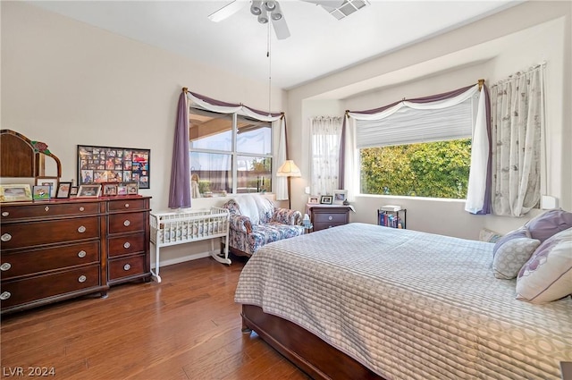 bedroom with wood-type flooring and ceiling fan