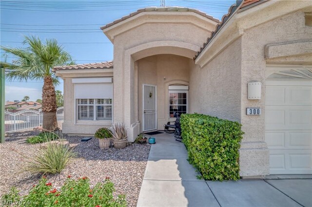 entrance to property featuring a garage