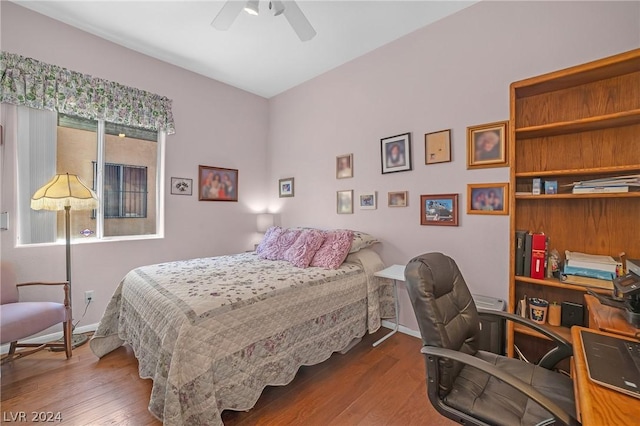 bedroom with hardwood / wood-style floors and ceiling fan