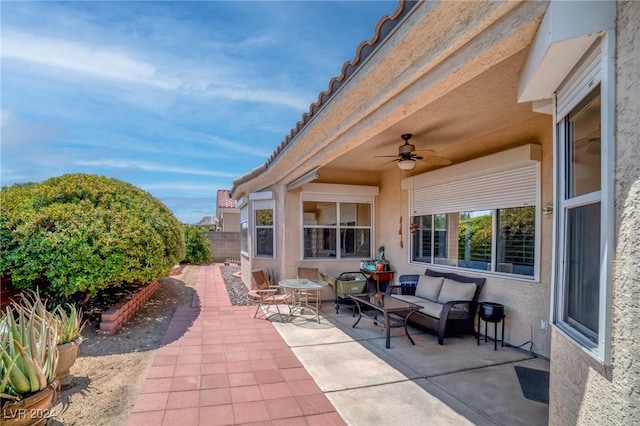 view of patio / terrace with ceiling fan and outdoor lounge area