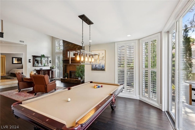 rec room featuring a wealth of natural light, a fireplace, dark hardwood / wood-style floors, and billiards