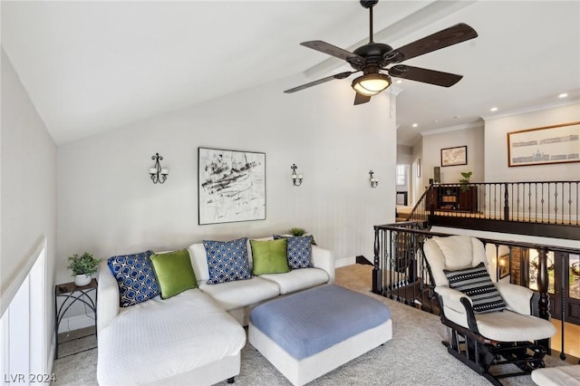 living room with ceiling fan, crown molding, light colored carpet, and vaulted ceiling