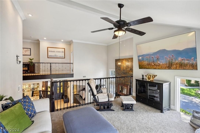 carpeted living room with ceiling fan and ornamental molding