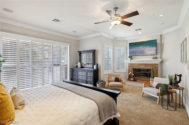 bedroom with carpet, ceiling fan, crown molding, and a high end fireplace