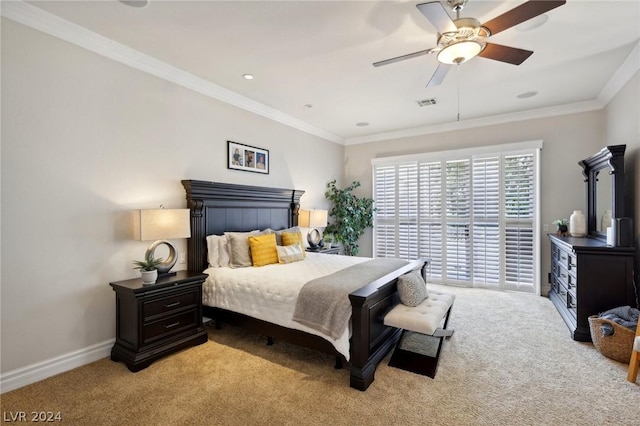 carpeted bedroom with ceiling fan and crown molding