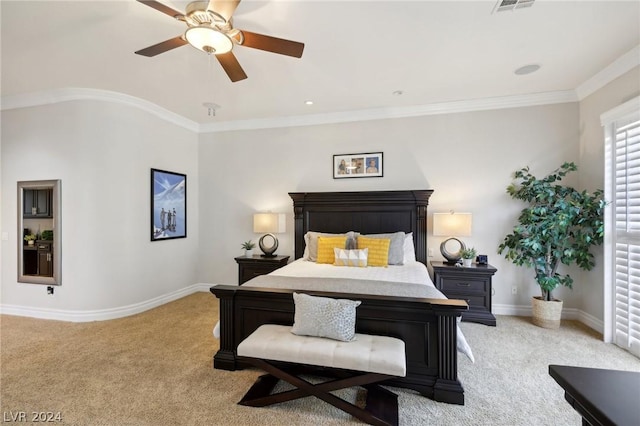 carpeted bedroom with ceiling fan and crown molding