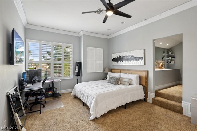 carpeted bedroom with ceiling fan and crown molding