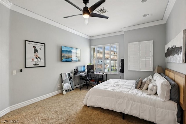 carpeted bedroom with ceiling fan and crown molding