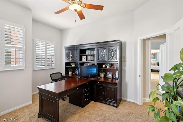 office area with light colored carpet and ceiling fan