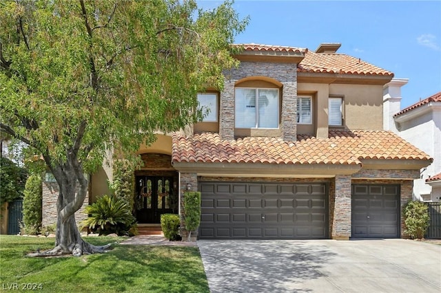 mediterranean / spanish house featuring a garage