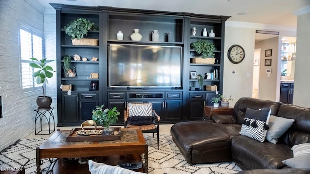 living room featuring built in features and ornamental molding