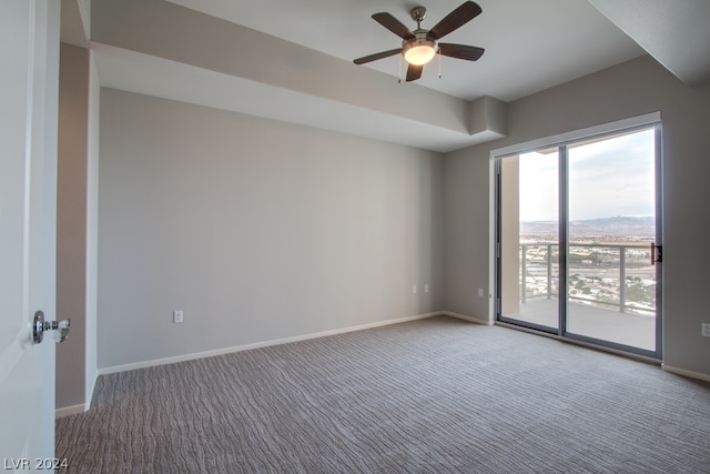 empty room with ceiling fan and carpet