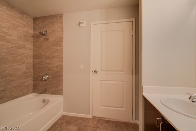 bathroom featuring vanity, tile patterned floors, and tiled shower / bath combo