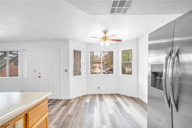 dining room featuring light hardwood / wood-style flooring and ceiling fan