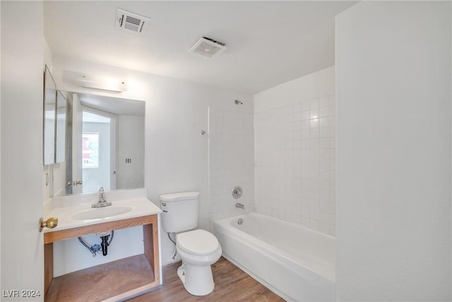 845 Mesquite Springs Dr Unit 101, Mesquite, NV 89027 - full bathroom featuring toilet, visible vents, wood finished floors, and shower / tub combination