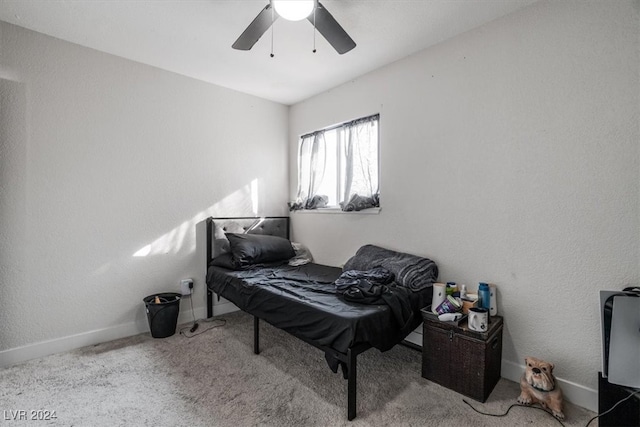 living area with ceiling fan and light carpet