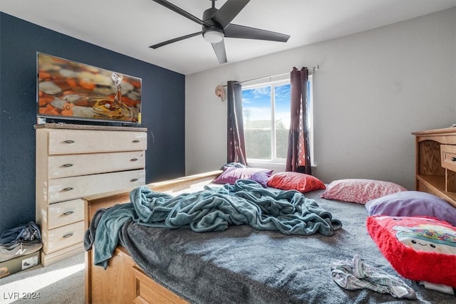 bedroom featuring ceiling fan and carpet