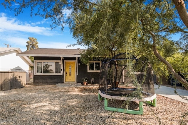 view of front of home with a trampoline