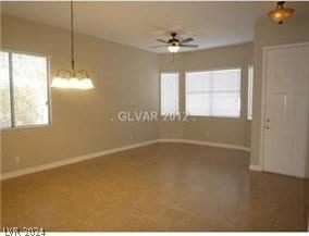 unfurnished room featuring ceiling fan