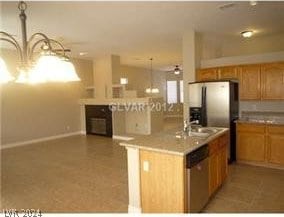 kitchen featuring dishwasher, sink, and light tile patterned floors