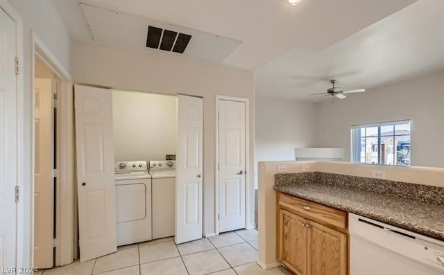 kitchen featuring light tile patterned flooring, white dishwasher, washer and clothes dryer, and ceiling fan