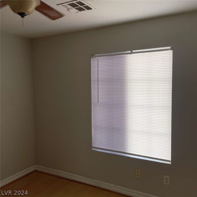 unfurnished room featuring hardwood / wood-style flooring and ceiling fan