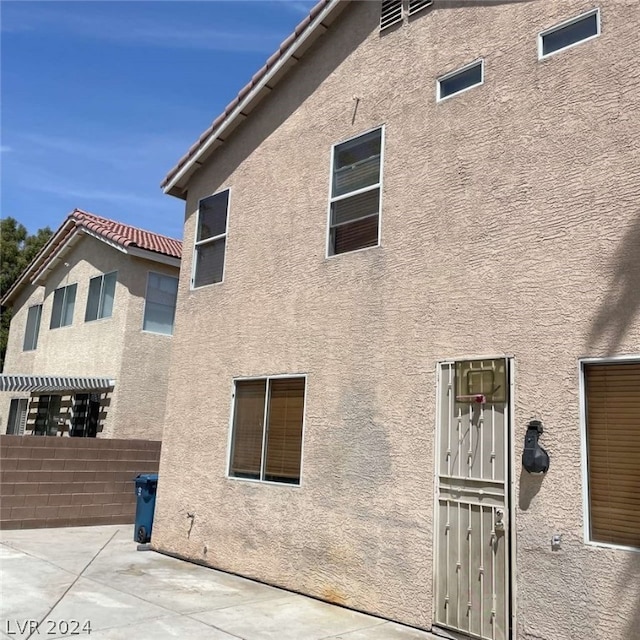 rear view of property with a patio area