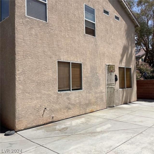 back of house featuring a patio area