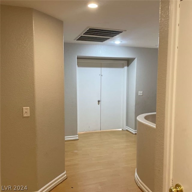 hallway featuring light hardwood / wood-style flooring