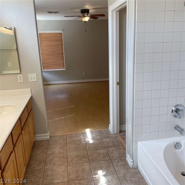 bathroom featuring tile patterned floors, vanity, and ceiling fan