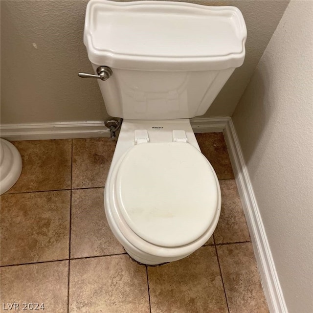 bathroom featuring tile patterned floors and toilet