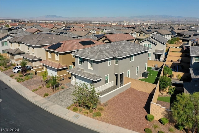 birds eye view of property featuring a mountain view