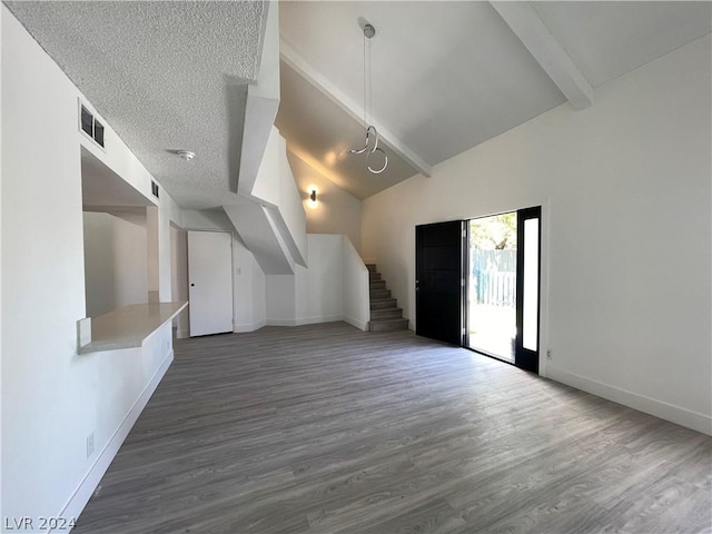 additional living space with beam ceiling, high vaulted ceiling, dark hardwood / wood-style floors, and a textured ceiling