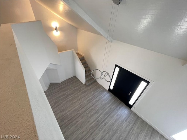 bonus room with lofted ceiling and dark wood-type flooring