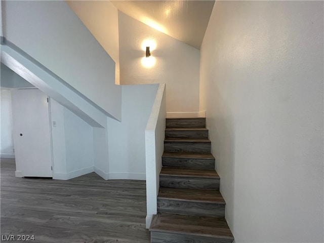 4281 White Sands Ave, Las Vegas, NV 89121 - stairs with wood finished floors, lofted ceiling, and baseboards