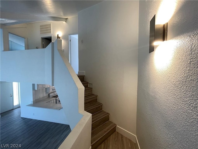 stairway featuring hardwood / wood-style floors