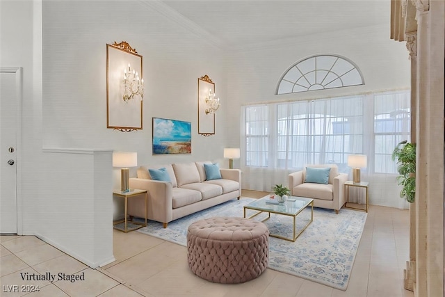 living room featuring tile patterned floors and crown molding