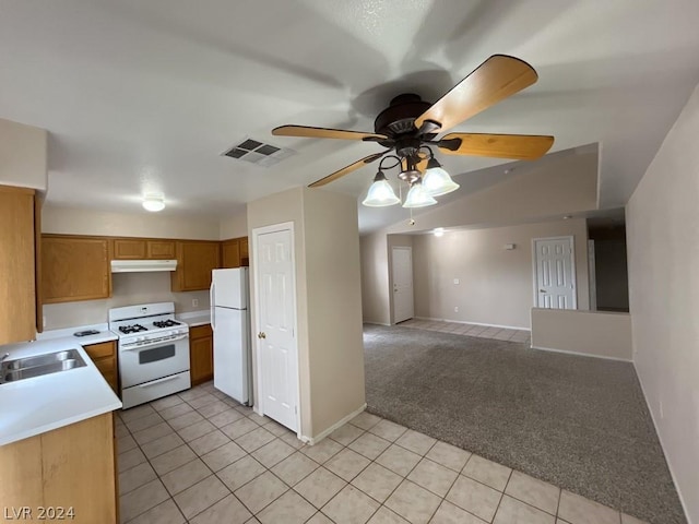 kitchen featuring light carpet, sink, white appliances, and ceiling fan