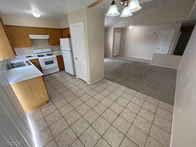 kitchen with pendant lighting, sink, white appliances, ceiling fan, and light colored carpet