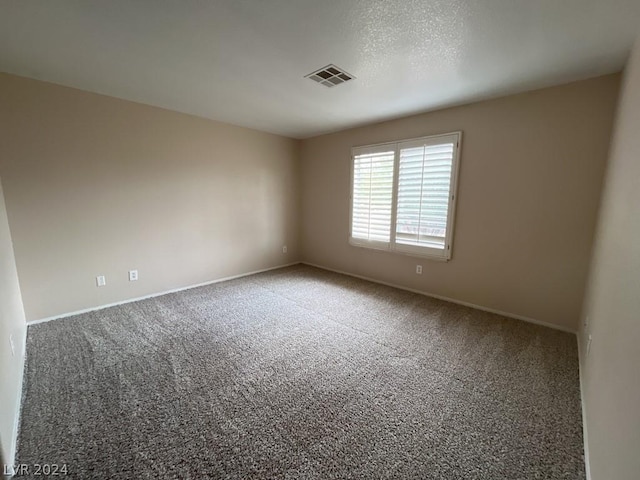 empty room featuring carpet