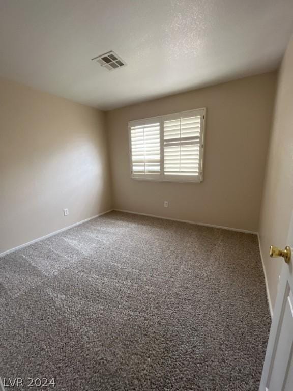 spare room with carpet flooring