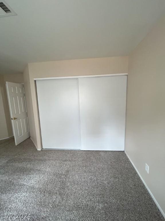 unfurnished room with carpet floors