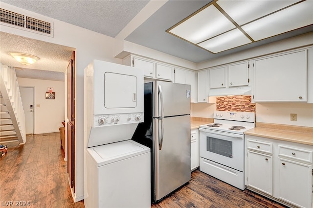 kitchen featuring stainless steel refrigerator, white range with electric stovetop, stacked washer / dryer, white cabinetry, and dark hardwood / wood-style flooring